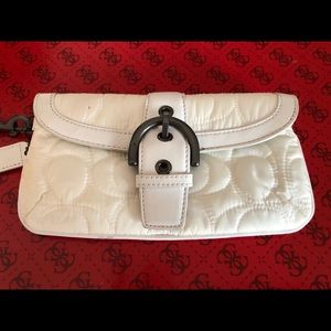 FREE w/purchase of any bag or shoe over $25. Wristlet. White with buckle.